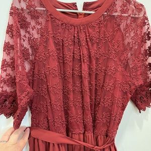 Adorable maroon illusion lace dress with sash. Only worn once.